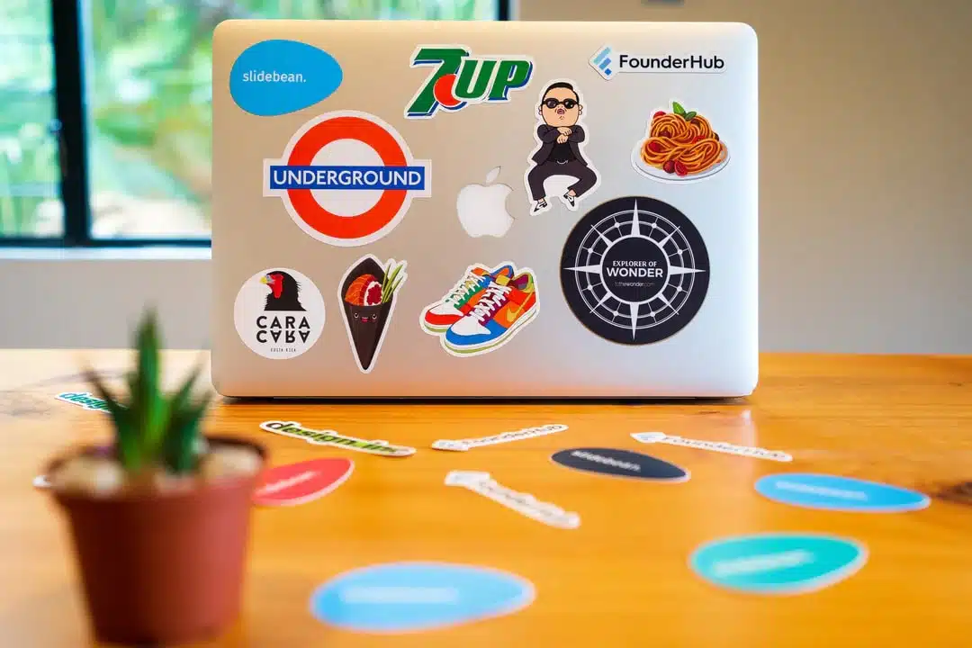 A picture of a laptop covered with stickers