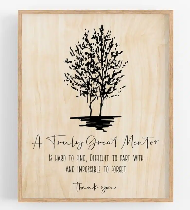 A picture of a wooden picture of a tree with some words