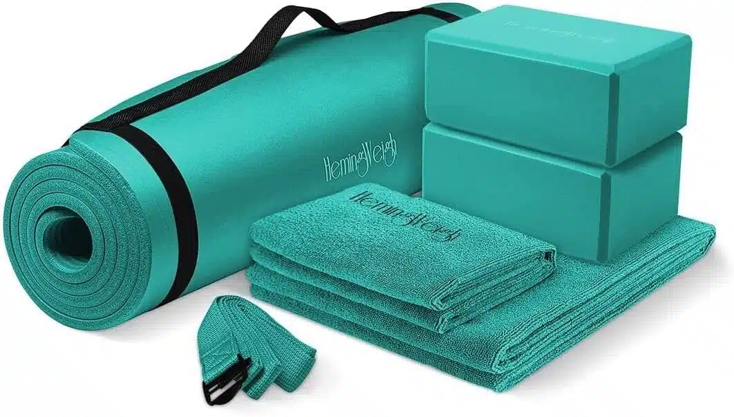 A picture of a yoga mat, blocks, towels, and straps